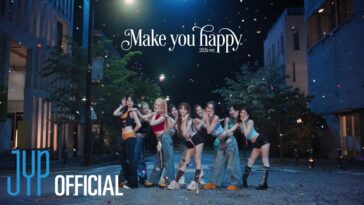 NiziU se apresenta em um cenário noturno, cercadas por confetes e luzes, promovendo a música "Make You Happy".